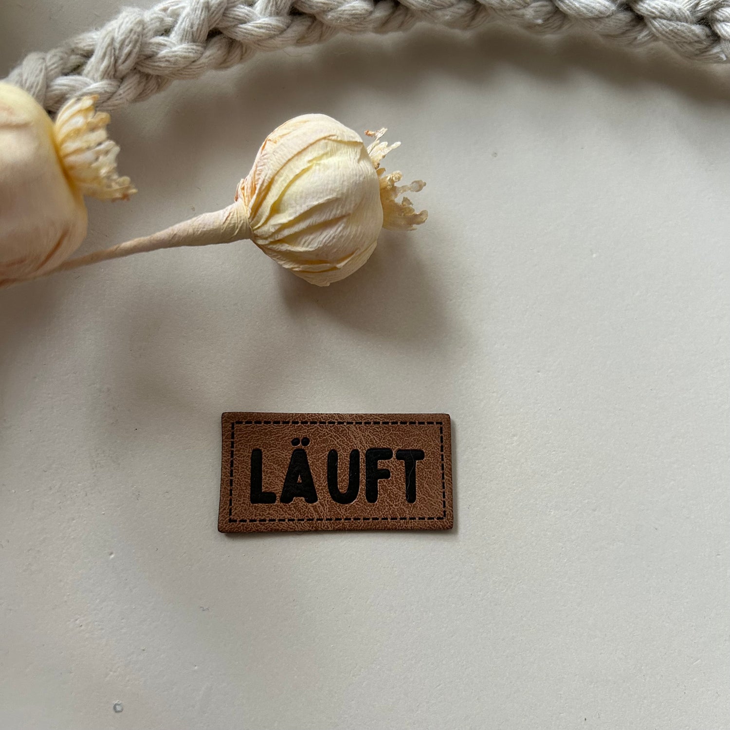 1 Kunstlederlabel LÄUFT 2010-0049